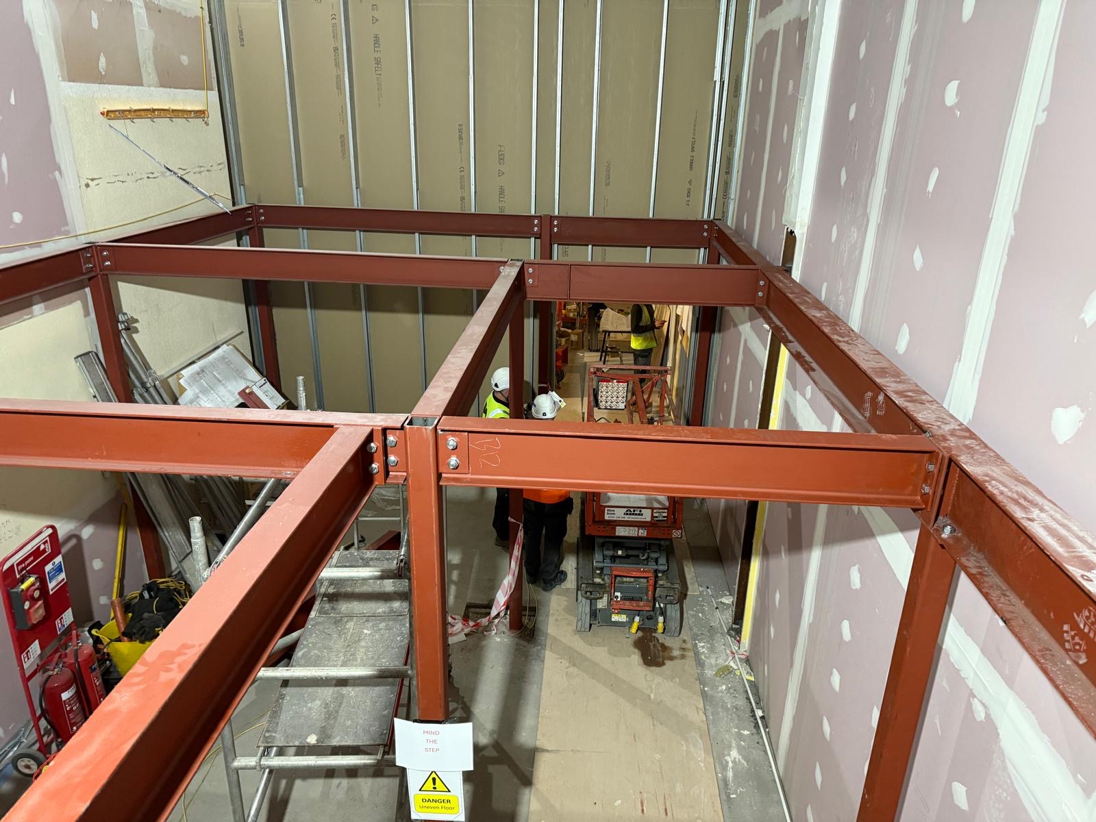 Colemans Steel fabrication team working on a commercial mezzanine steel frame during construction